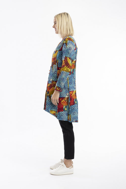Model showcasing the Billie Jean Coat Reversible in vibrant patterns and colors, highlighting its unique design and style.