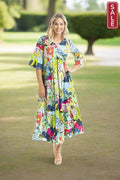Elafonissi Dress Peak Midi showcased in a vibrant print with three-quarter sleeves, ideal for summer outings.