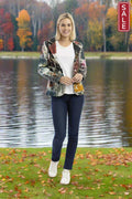 Model wearing New York Blazer over a white t-shirt by a lake in autumn scenery.