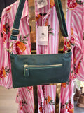 Atn Crossbody Leather Bag displayed with a stylish floral shirt, showcasing its elegant design and detachable strap.