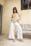 Sophia T-shirt showcased on a model, featuring colorful prints and a chic V-neckline, perfect for stylish adventures.