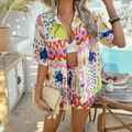 Vibrant Ibiza shorts styled with a matching colorful shirt, showcasing a fun summer look by the pool.