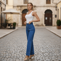WK 3085 Patch pocket jean displayed by model on a cobblestone street, showcasing high-rise and wide leg design.