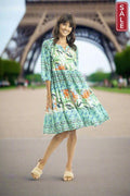 Olivia 3/4 Sleeve Layered Dress in a vibrant floral print, perfect for stylish summer outings at the Eiffel Tower.