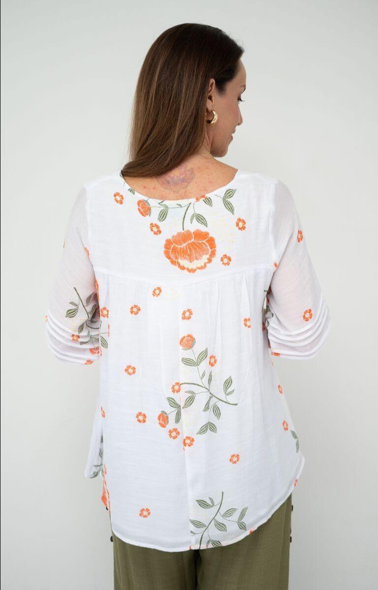 QQ Julia Layered Top in white with orange floral details, viewed from the back.