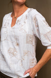 Gold Embroidered Top featuring textured cotton, V neck, and elbow length sleeves, perfect for versatile styling.