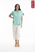 Essentials Linen Blend V Neck Top Aqua worn by a model, featuring a mandarin collar and short sleeves, perfect for everyday wear.