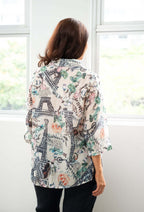 Back view of woman wearing WT Suzy Eiffel tower Shirt with Parisian design, showcasing the lightweight fabric and collar.