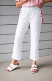 Nia Button Pocket Pants displayed in white with button details and a smooth fit, perfect for spring styling.