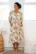 WT Botanical Pheasant dress featured on a woman with short sleeves and floral design, perfect for effortless elegance.