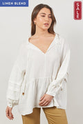 Model wearing the Panorama Relaxed top Dove in linen blend, showcasing its relaxed fit and feminine details.