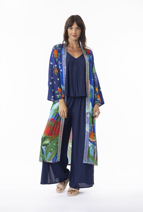 Arabian Nights Wrap Long worn by model, featuring vibrant floral patterns and kimono sleeves for bohemian elegance.