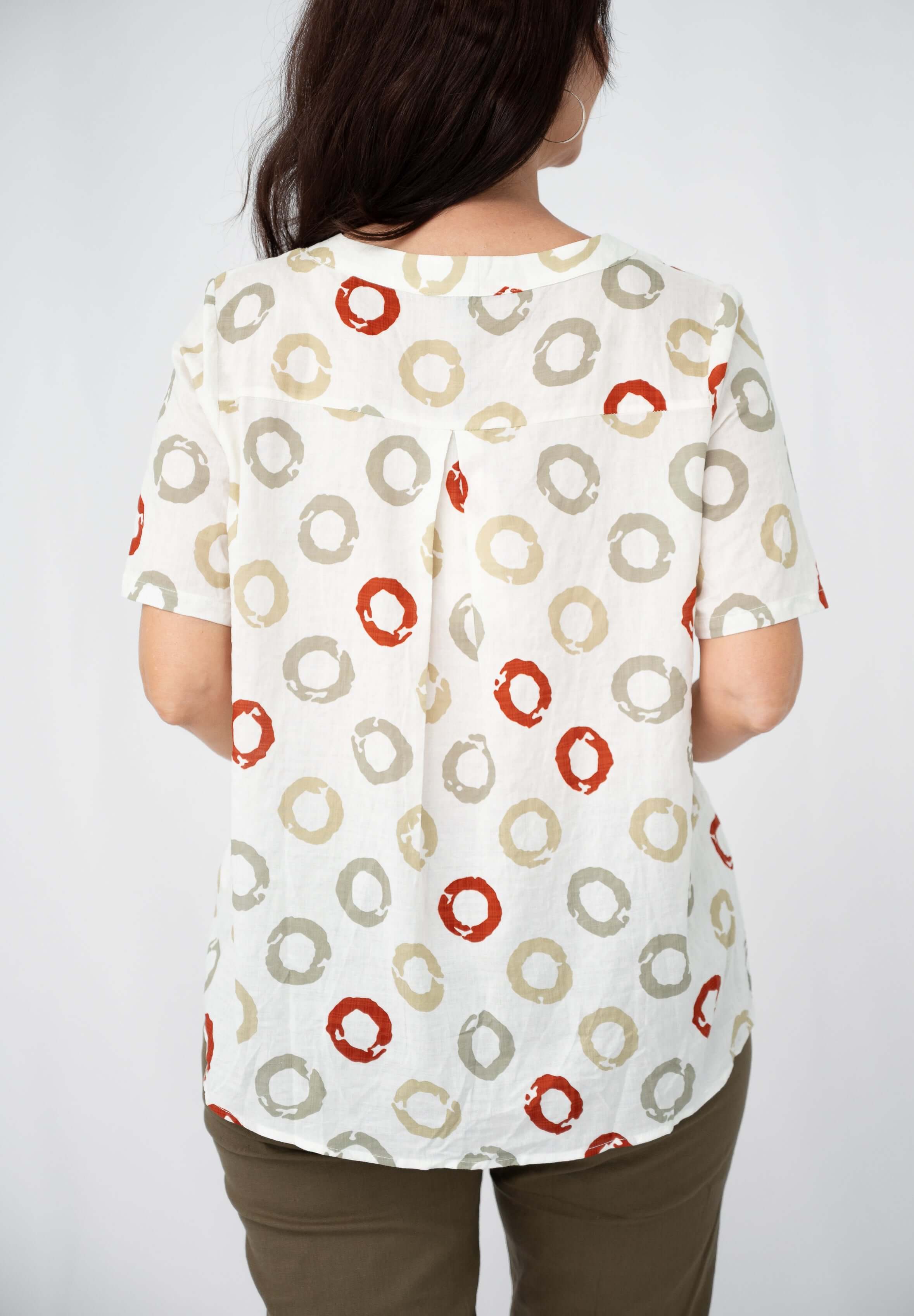 Vera Sequin pocket top featuring a playful circle pattern and soft rayon-cotton blend for comfort.