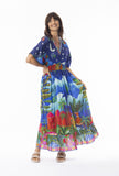 Model wearing the Arabian Nights Dress Shirred Waist with a vibrant print and relaxed kimono sleeves.