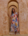 Model wearing the Amisha Maxi in Tangier, showcasing colorful floral patterns and a relaxed fit with charming details.