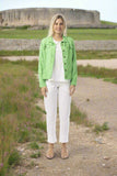 Linen Essentials Jacket-Parakeet worn by a model on a scenic path, showcasing summer style and elegance.