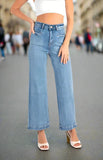 Model wearing Dakota Jeans with wide leg silhouette and high-rise waist, showcasing contemporary denim style.