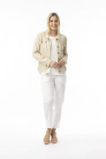 Model wearing the Essentials Jacket sand with stylish frayed trim and front pockets, perfect for summer layering.
