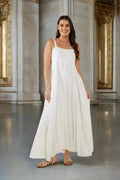 Sardinia Maxi Bianco elegantly displayed in luxurious linen, featuring a square neckline and a flowing A-line skirt.
