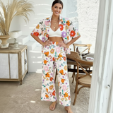 Stylish woman wearing a Flower shirt with vibrant floral patterns, perfect for summer outfits.