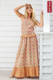 Mindy Top in floral print, perfect for summer, displayed on a model with a smile, highlighting stylish frill trim.
