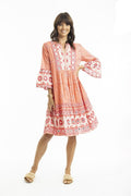 Heidi Layered Dress Frill Sleeve Coral styled in a boho look with playful frill sleeves and vibrant prints.