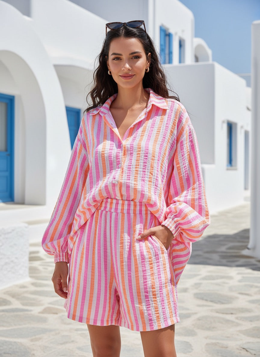 Model wearing a casual Candy striped shirt 945 with matching shorts, showcasing vibrant pink, white, and orange stripes outside.