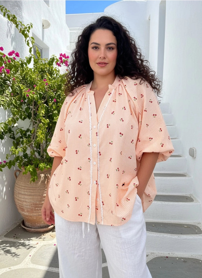 Cherry Shirt Tangerine model wearing a stylish Nehru collar shirt with lace placket and elasticated sleeves.