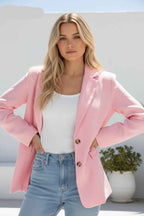 Model wearing the Aurora Blazer in pink, showcasing modern elegance with premium fabric and tailored fit.