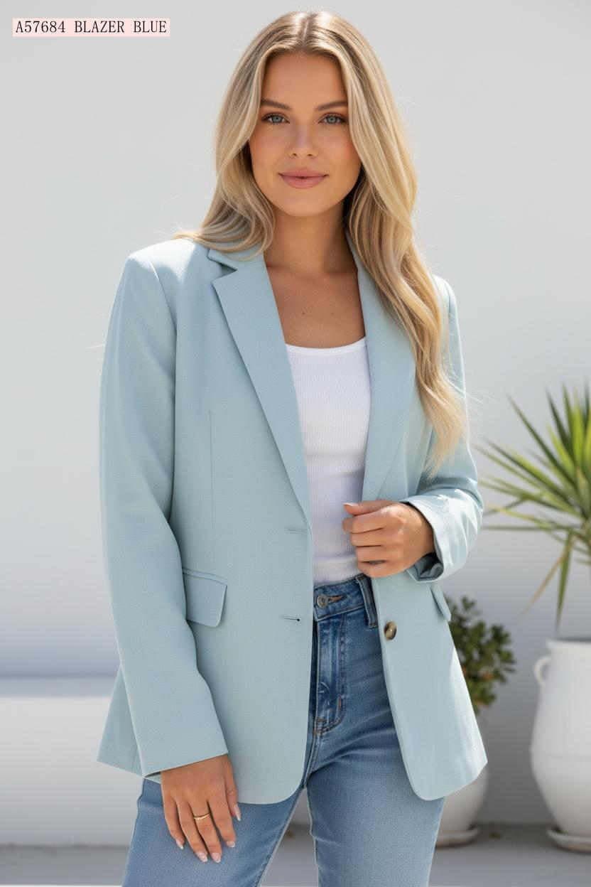 Model wearing the Aurora Blazer in light blue, showcasing polished and elegant style.