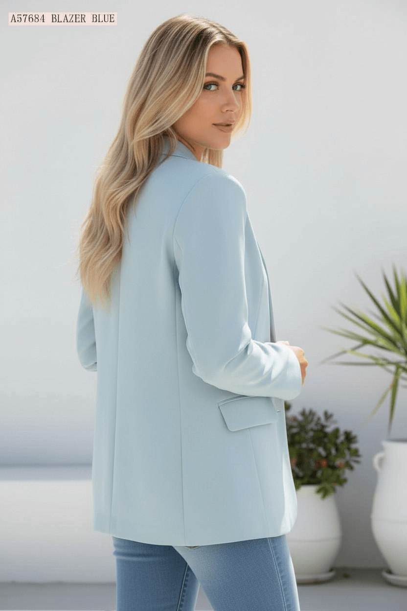 Aurora Blazer in soft blue color with elegant tailoring, showcased in a stylish outdoor setting.