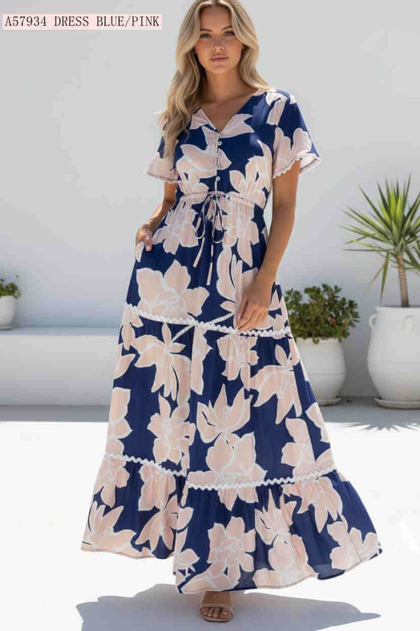 Collette Maxi Dress featuring magnolia print on navy rayon with drawstring waist and tiered skirt.