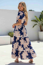 Collette Maxi Dress featuring a navy magnolia print and ric rac trim, perfect for effortless elegance and summer outings.
