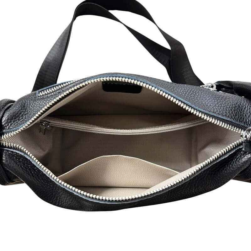 Interior view of the Kate Leather Bag showing multiple compartments and elegant zipper detailing.