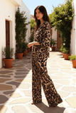 Model showcasing the Giada Animal Print Tunic in a sunny outdoor setting, styled with effortless elegance.