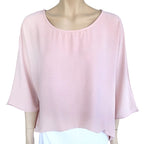 Eva Crew Neck top in soft pink color with round neckline and flowy sleeves on a mannequin.