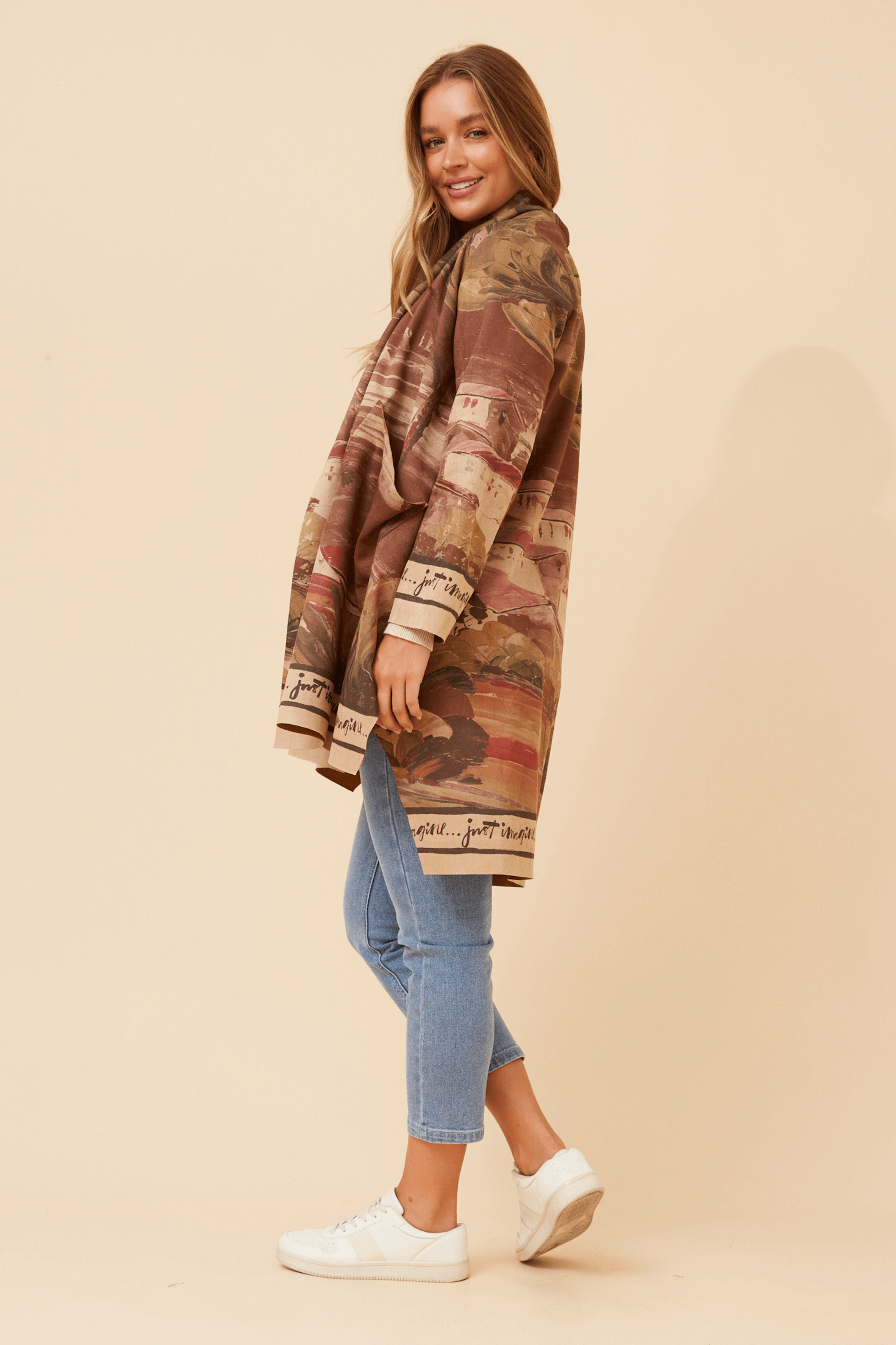 Model wearing the Francisco Coat Brown, showcasing its elegant design and relaxed fit.
