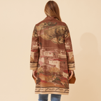 Woman wearing the Francisco Coat Brown, showcasing its elegant design and relaxed fit from the back.