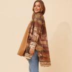 Woman wearing the stylish Francisco Coat Brown, showcasing its elegant design and relaxed fit.