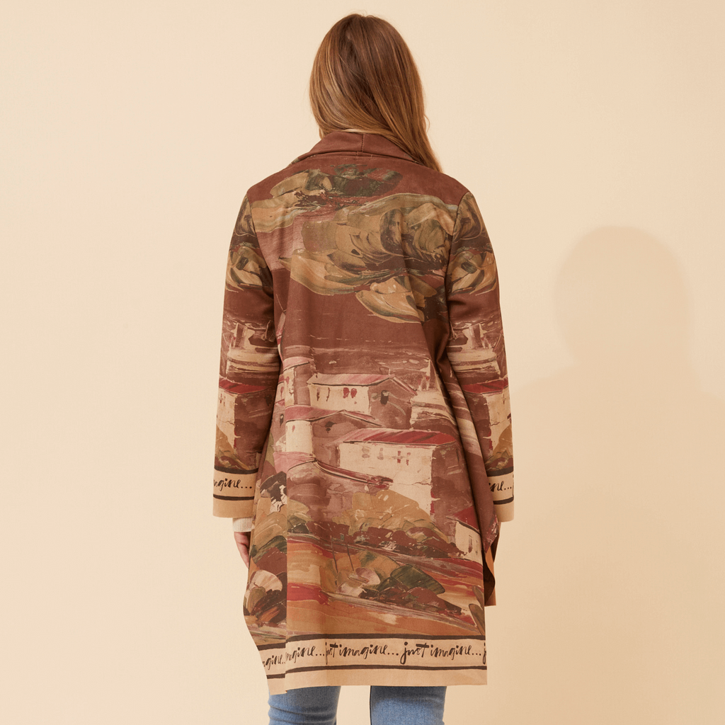 Woman wearing the Francisco Coat Brown, showcasing its elegant design and relaxed fit from the back.