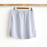 Orientique Slip Skirt in light gray with lace trim and elastic waist, length approx 51cm.