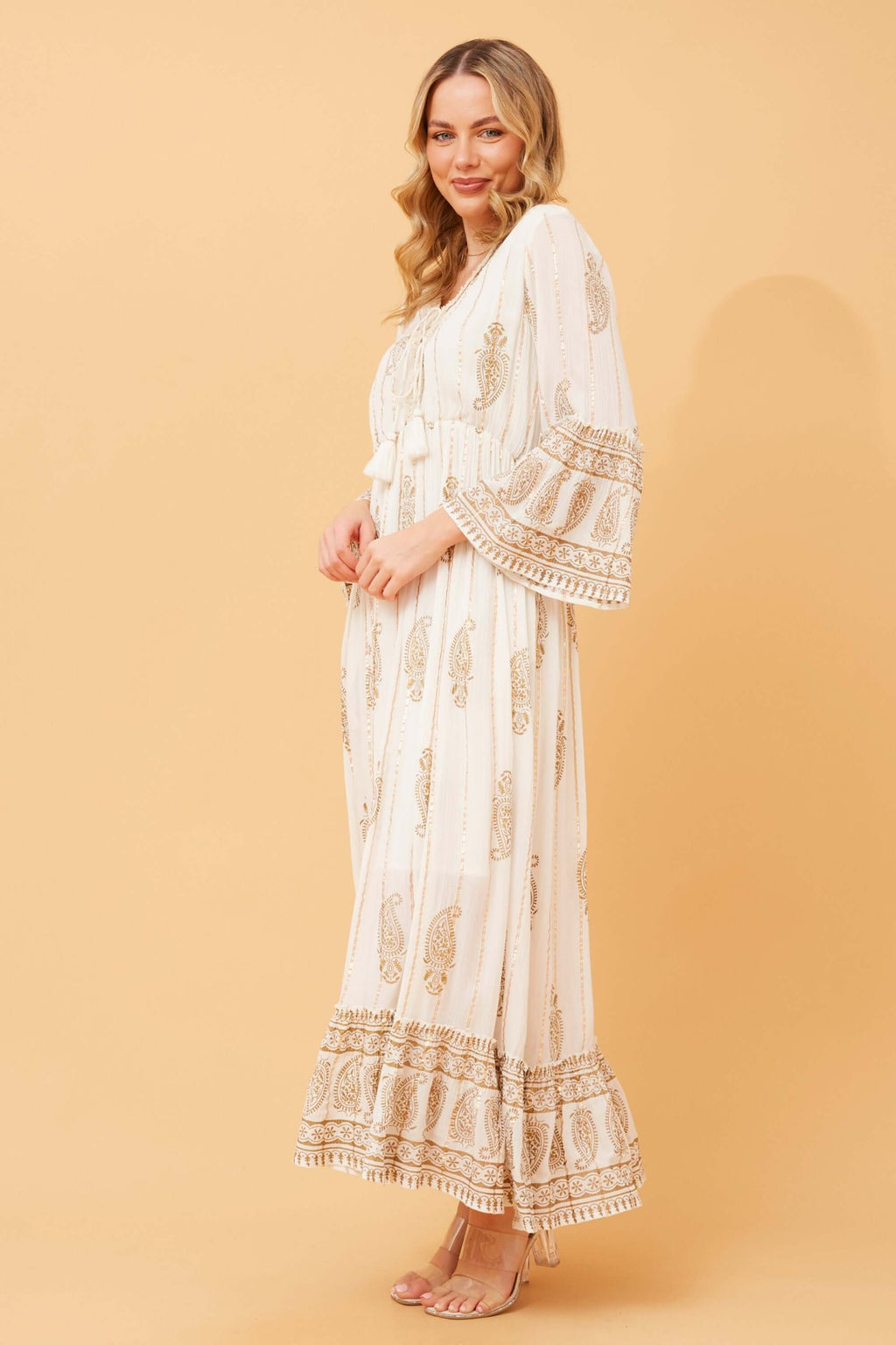 Ketia Tiered Dress in Mystic Monsoon Cream with gold details and flared sleeves, perfect for special occasions.