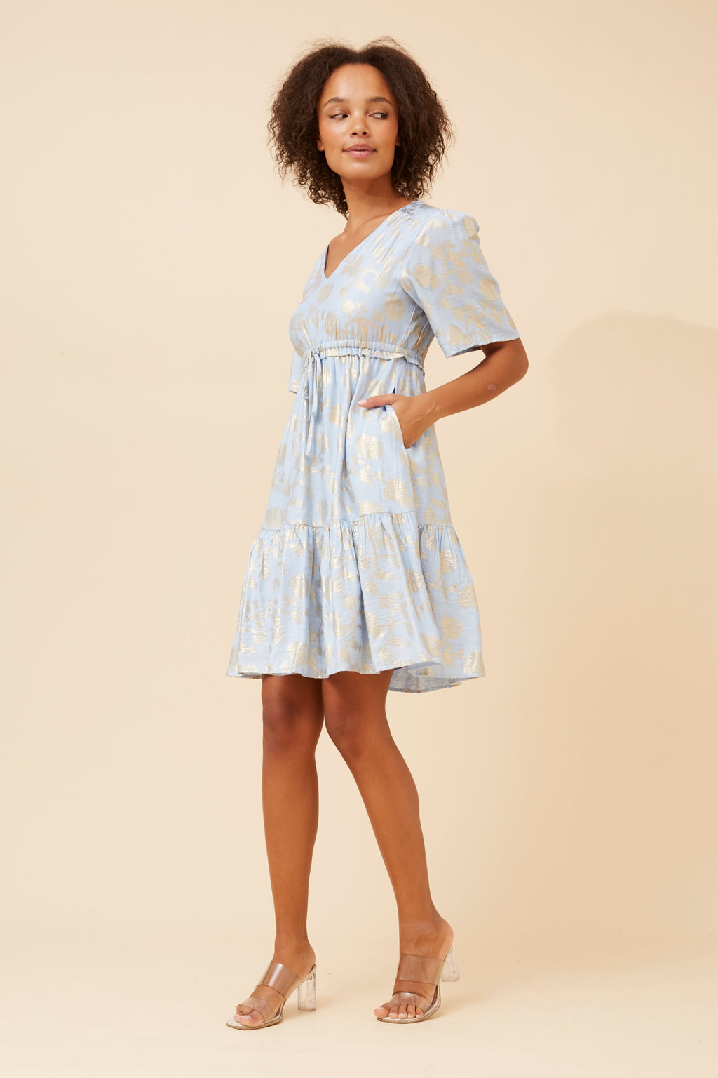 Elegant Gold Foil Dress in pale blue with a flattering V-neckline and pockets, perfect for warm weather.