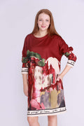 Model wearing a Blancha Long sleeve dress with a colorful artistic design, showcasing elegant style and comfort.