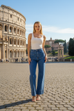 Model wearing Wide Leg Pocket Jeans in front of the Colosseum, showcasing contemporary denim style.
