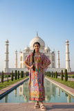 Francesca Kaftan worn against the stunning backdrop of the Taj Mahal, showcasing its vibrant colors and flowing design.