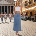 WK Denim skirt worn by a model in a sunny street setting with a historic building in the background.