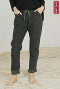 Stylish Coated Pants with elastic waist and pockets, perfect for comfort and flair during sales.