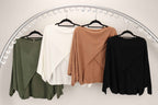 WL Crossover Sweater in four colors: green, white, brown, and black, showcasing the elegant crossover neckline design.