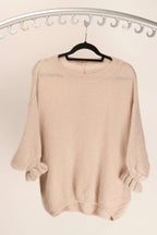 WL Fiorella Jumper on a hanger, showcasing luxurious alpaca blend fabric and feminine frill cuffs.
